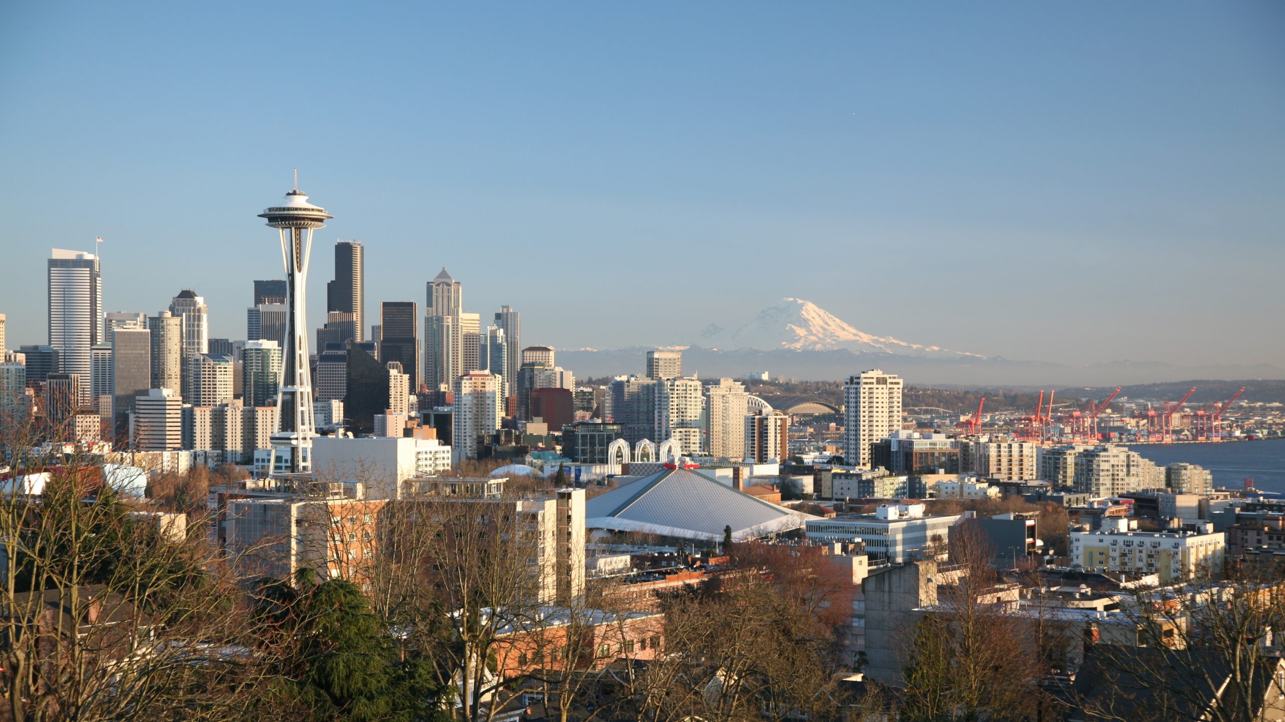 Seattle skyline during a sunny day with Mount Rainier on the Background.